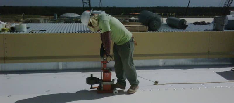 Contractor Working on a FiberTite Roofing System