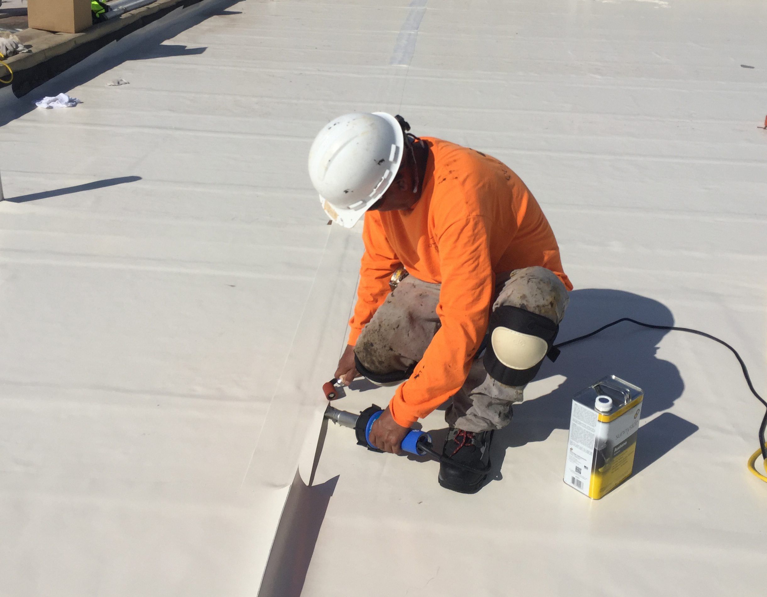 man working on roof